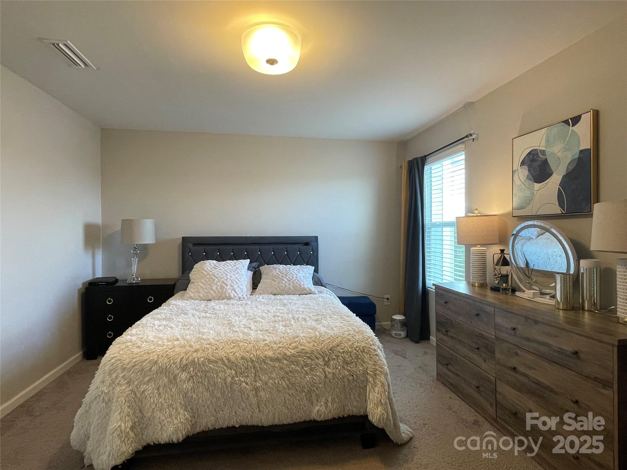 12417 Bryton Ridge Parkway Huntersville, NC 28078 - Photo 14 of 17 a bedroom with a bed and a dresser