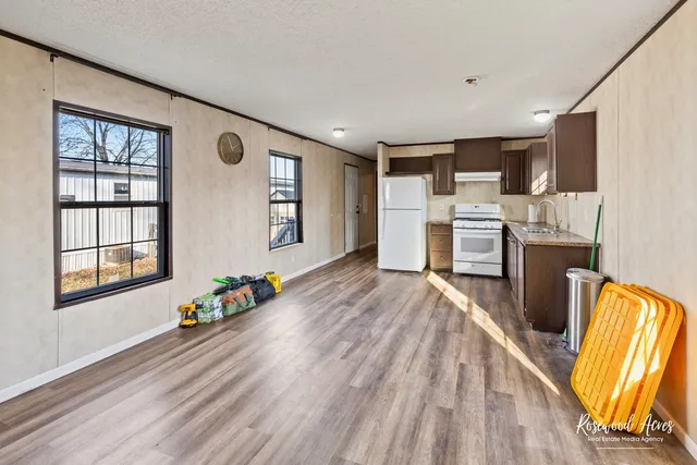 a very nice looking living room with a large window