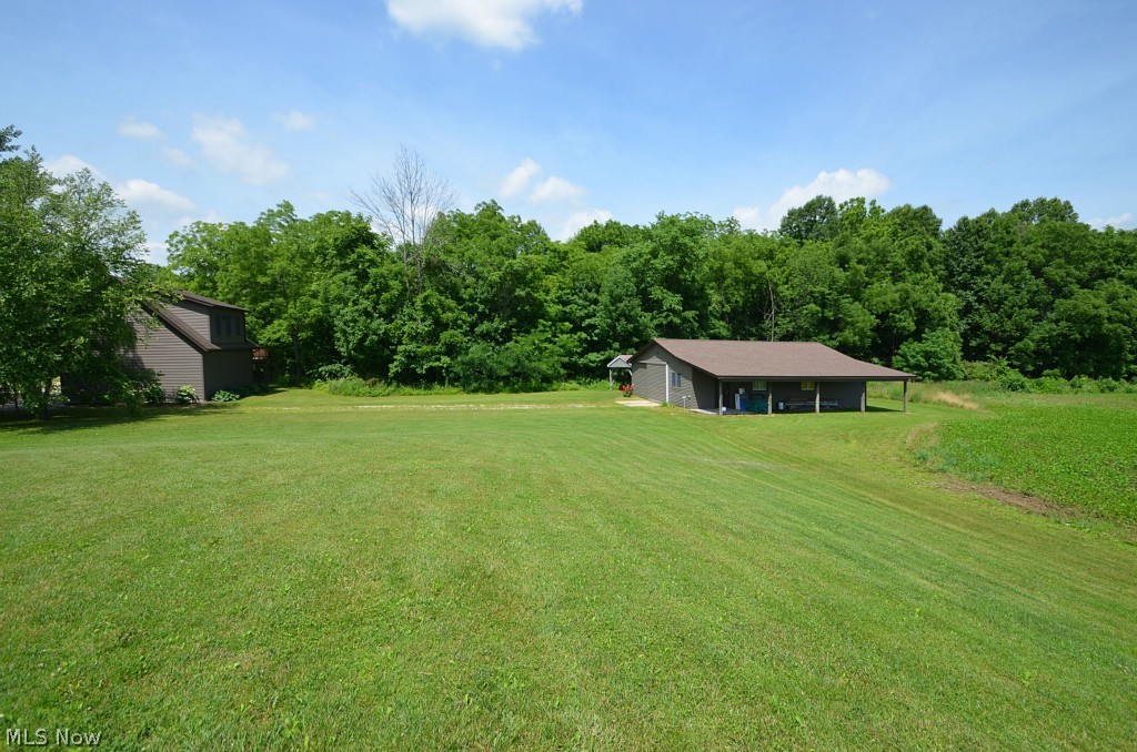 15860 Diagonal Road Lagrange, OH 44050 - Photo 9 of 25 Barn/Storage Building 30 Ft. x 40 Ft. Cement Floor, Horse Stalls, Two Large Doors at Two Sides, Two Large Sliding Doors on Two Walls that Lead Out and to Drive Through. Space to Store Large Vehicles, Boats, etc.