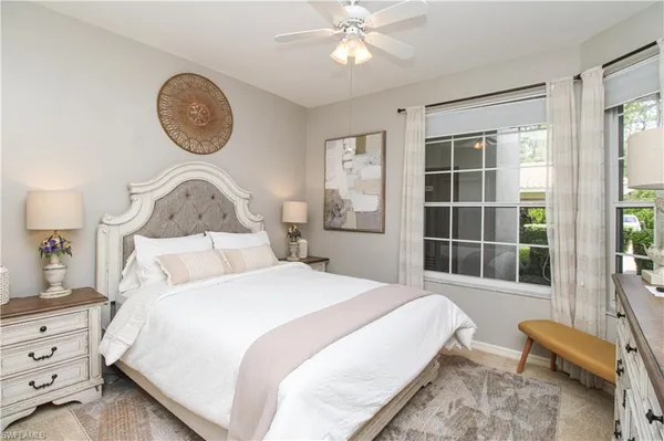 a bedroom with bed and a window