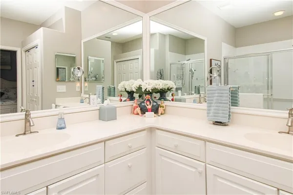 a bathroom with sink and mirror