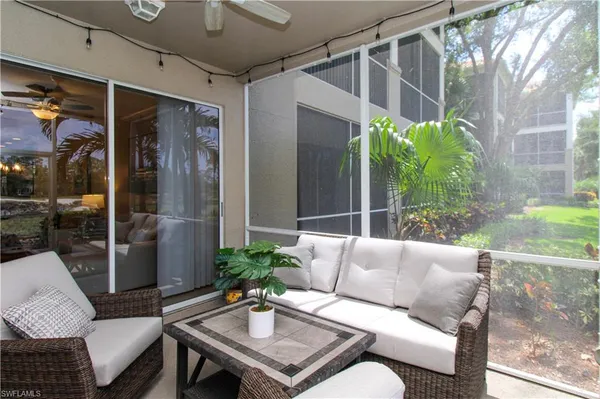 a outdoor living space with furniture and a potted plant