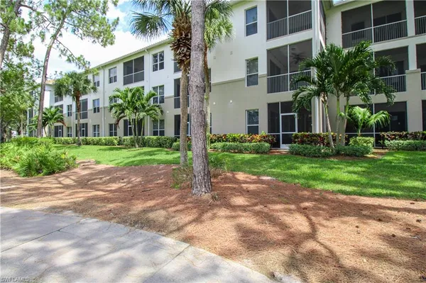 a view of a building with a yard