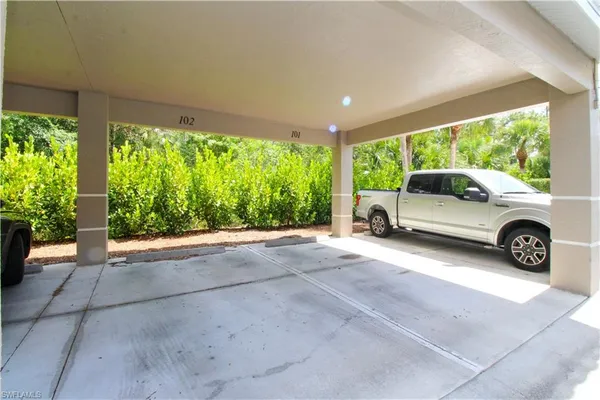 a view of car parked in back yard