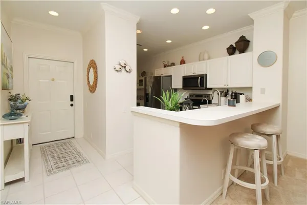 a bathroom with a sink a toilet a mirror and shower