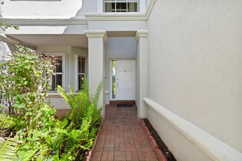 a view of a house with a flower garden