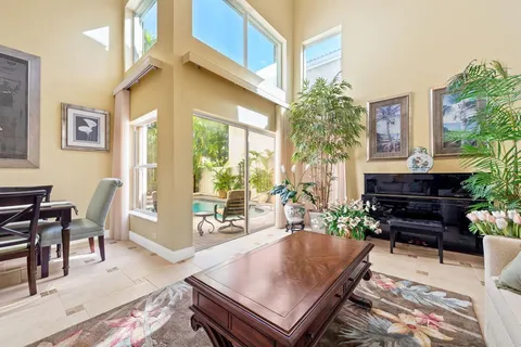 a living room filled with furniture and a potted plant