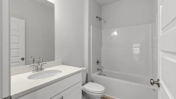 an empty room with closet area