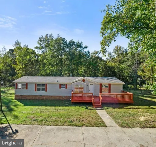 an aerial view of a house with a big yard