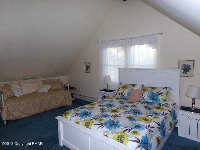 4152 Winchester Way Bushkill, PA 18324 - Photo 13 of 23 a bedroom with a bed and window