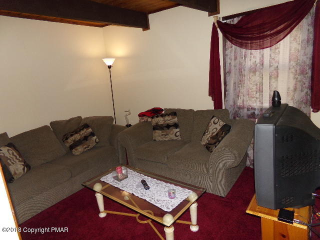 4152 Winchester Way Bushkill, PA 18324 - Photo 17 of 23 a living room with furniture and a flat screen tv