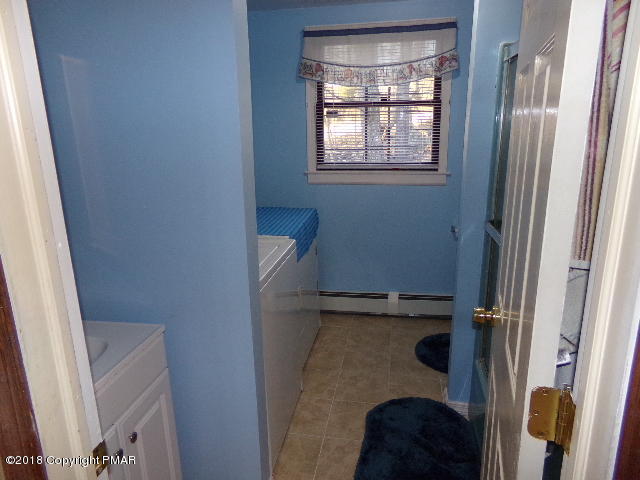 4152 Winchester Way Bushkill, PA 18324 - Photo 19 of 23 a bathroom with a sink and a shower