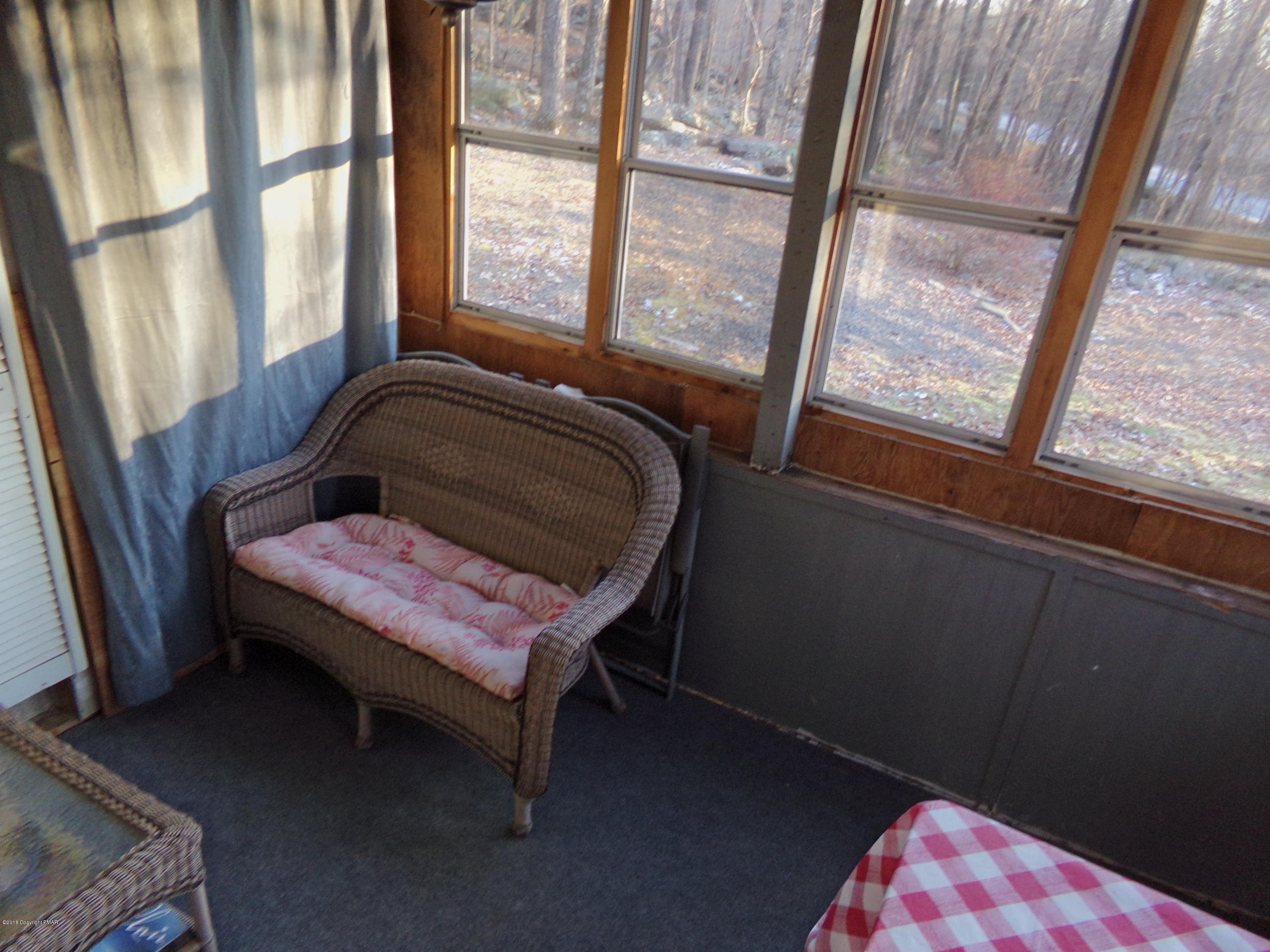 4152 Winchester Way Bushkill, PA 18324 - Photo 22 of 23 a bed sitting in a bedroom next to a window