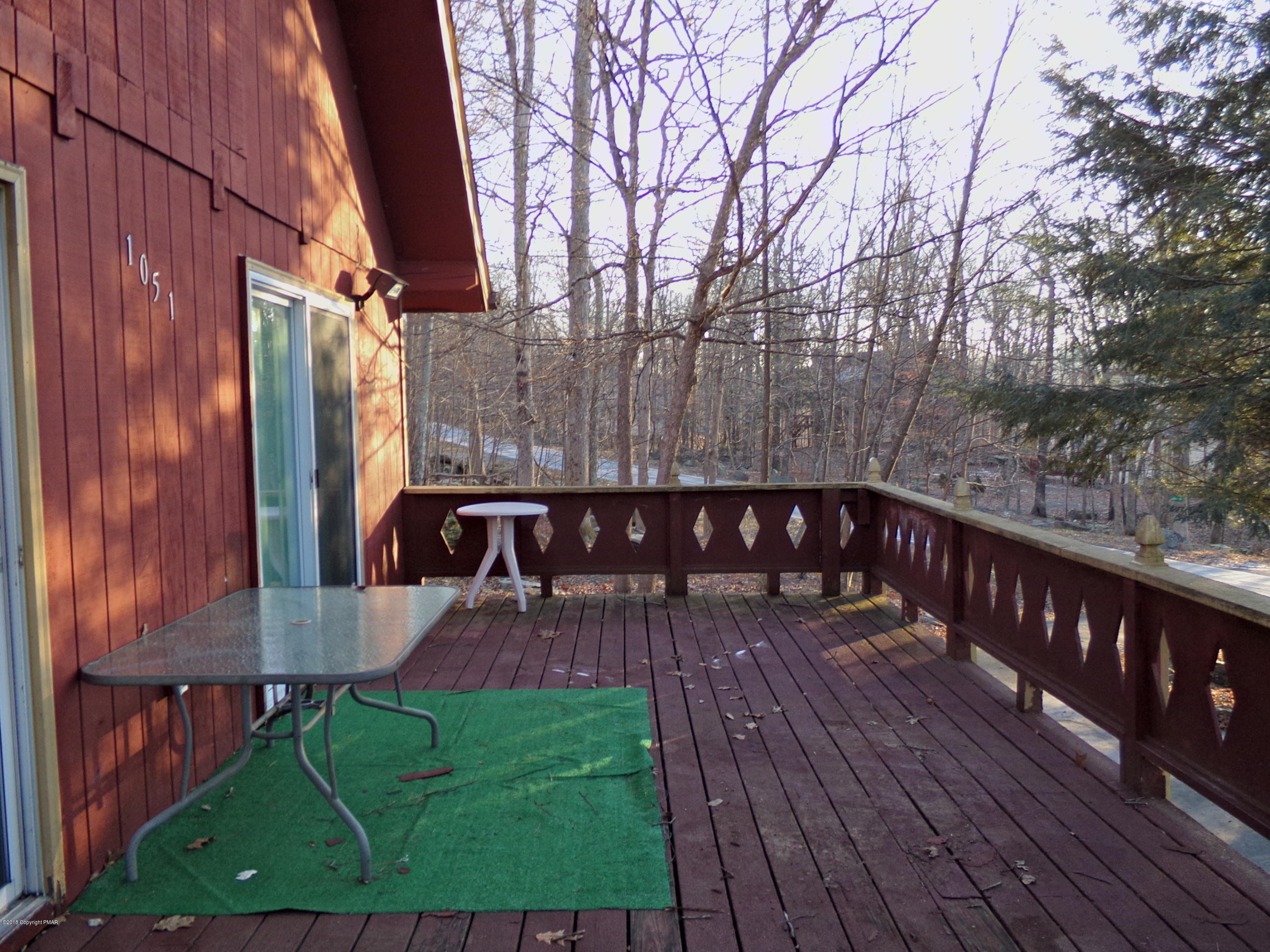 4152 Winchester Way Bushkill, PA 18324 - Photo 5 of 23 a balcony with wooden floor and outdoor seating