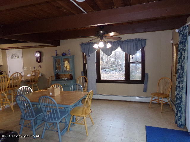 4152 Winchester Way Bushkill, PA 18324 - Photo 7 of 23 a view of a dining room with furniture and chandelier