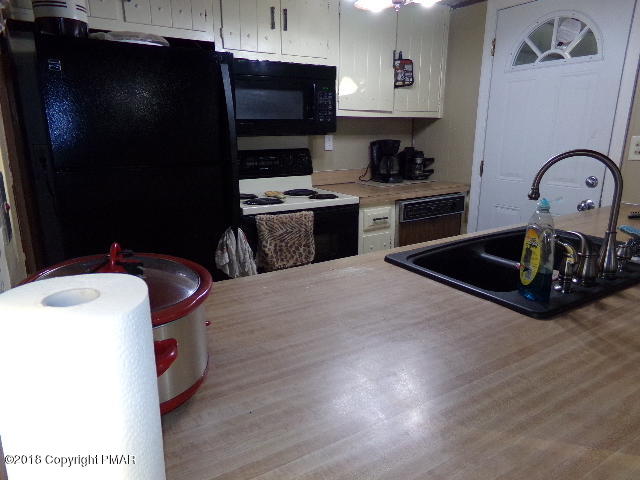 4152 Winchester Way Bushkill, PA 18324 - Photo 8 of 23 a kitchen with a sink appliances and cabinets