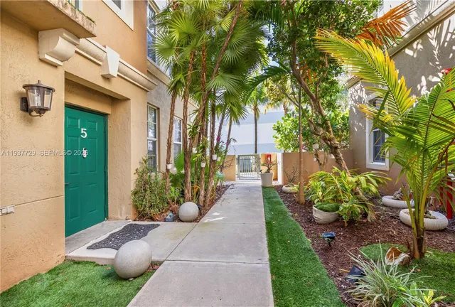 a view of a balcony with wooden floor