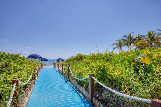 a view of a swimming pool with a yard