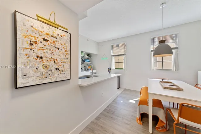 a view of a dining room with furniture and window