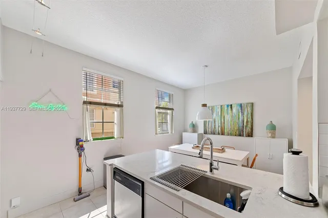 a living room with furniture and windows