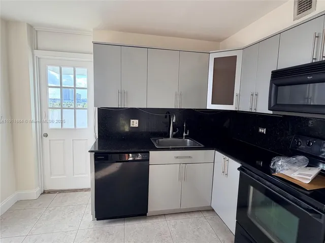 a kitchen with a stove and a microwave