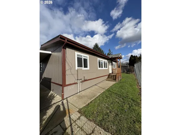 a house view with a backyard space