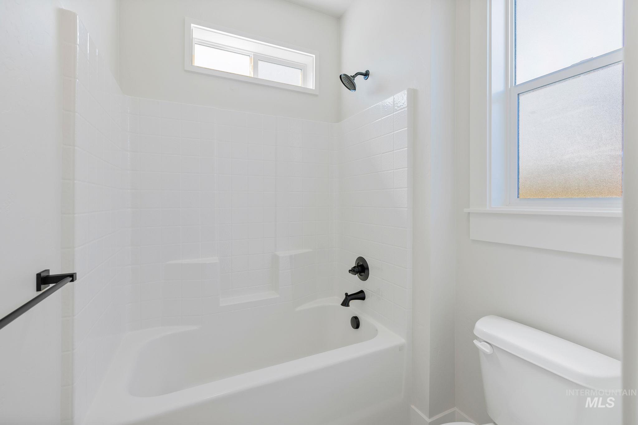 22 Bridger Street Cascade, ID 83611 - Photo 32 of 39 Full bathroom featuring toilet and tub / shower combination