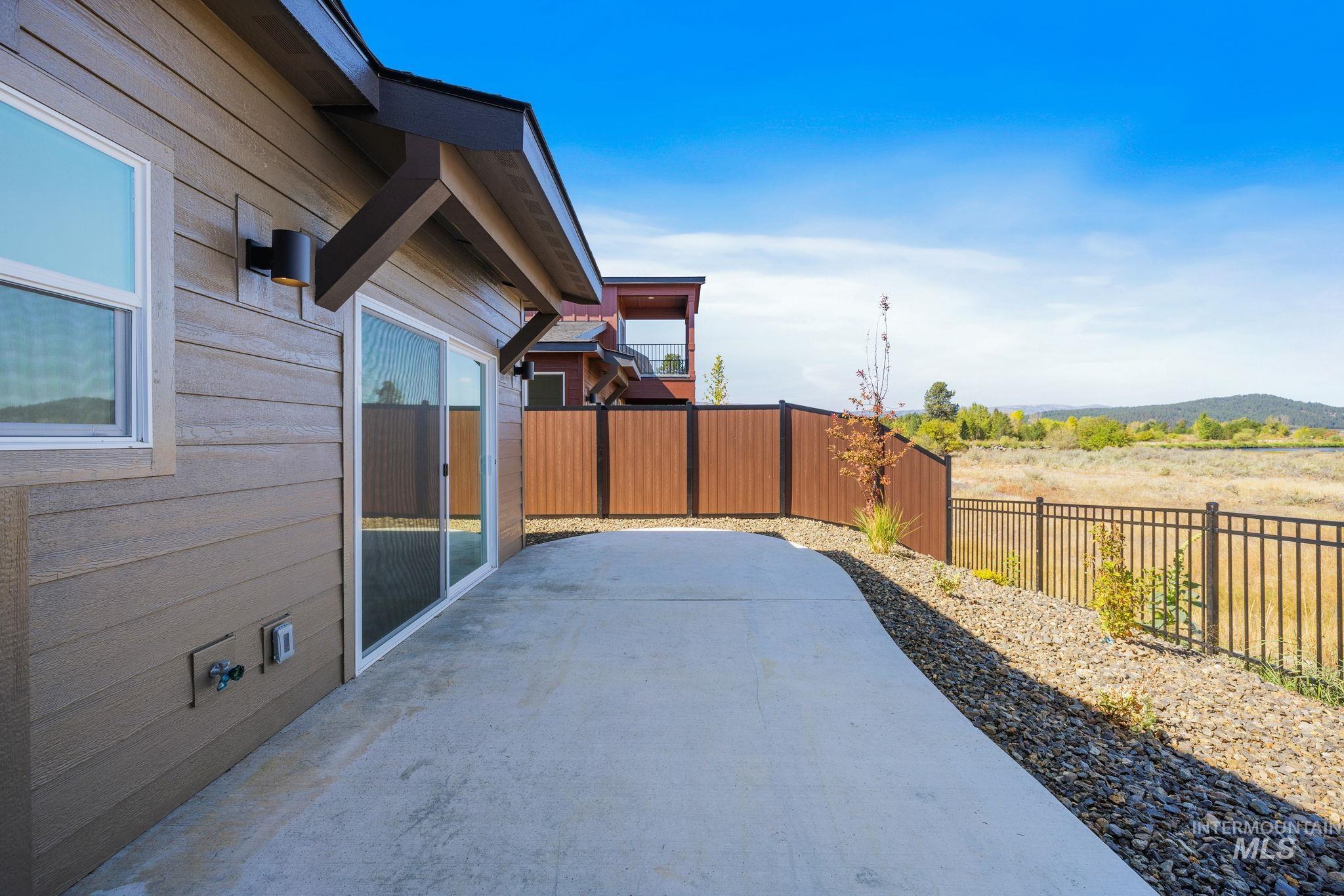 22 Bridger Street Cascade, ID 83611 - Photo 34 of 39 Fenced backyard with a patio