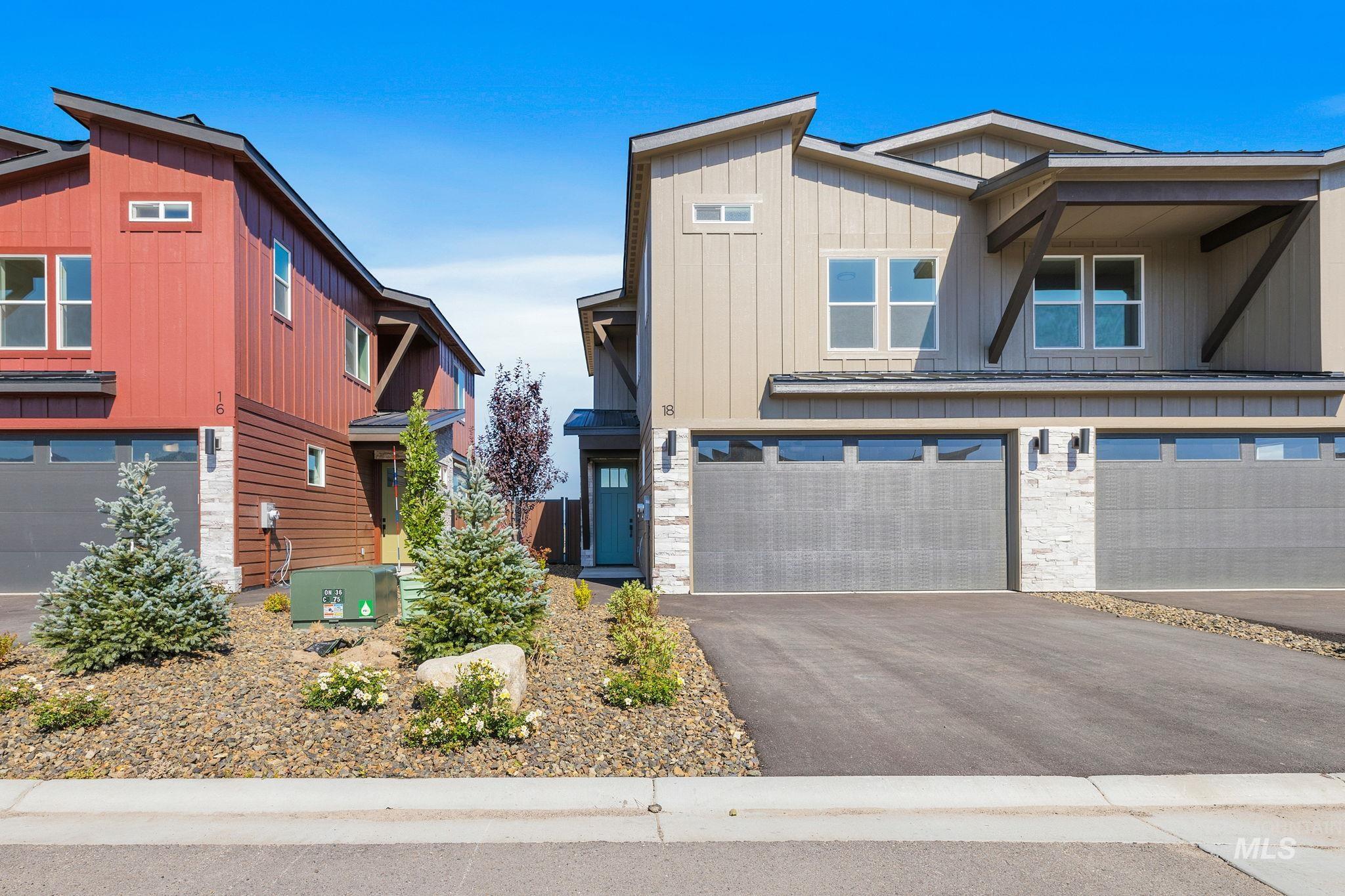 22 Bridger Street Cascade, ID 83611 - Photo 6 of 39 View of front of house with a garage, driveway, and board and batten siding