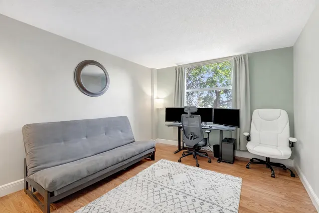 a living room with furniture and a closet