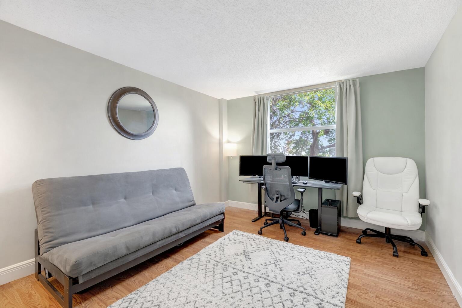 5260 Northwest 2nd Avenue, Unit 307 Boca Raton, FL 33487 - Photo 11 of 16 a living room with furniture and a window