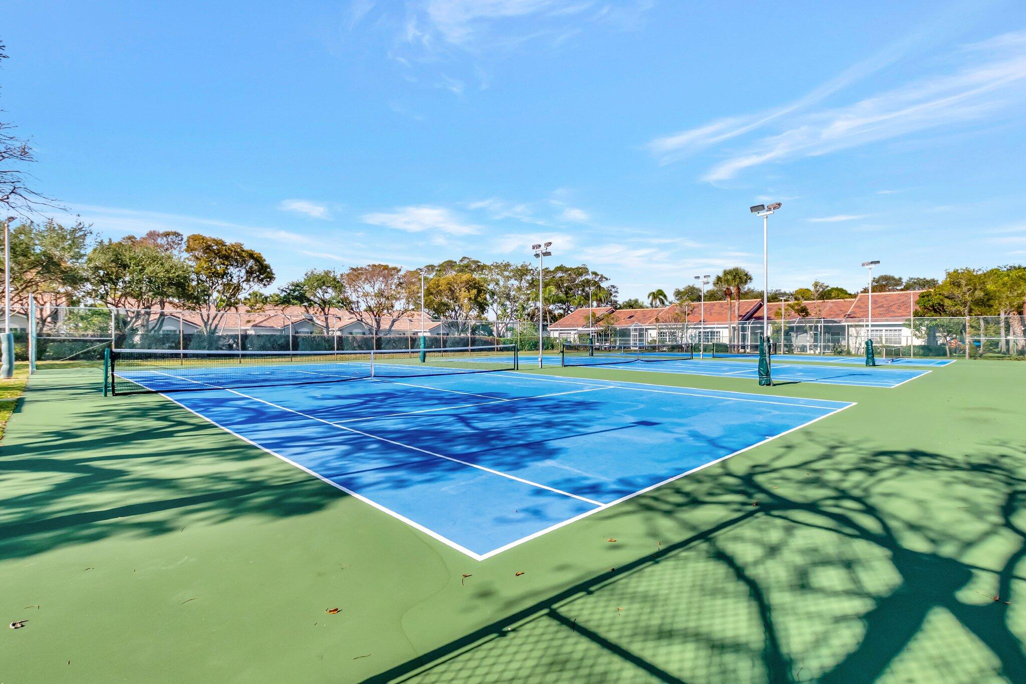 5260 Northwest 2nd Avenue, Unit 307 Boca Raton, FL 33487 - Photo 15 of 16 a view of an outdoor space and tennis court