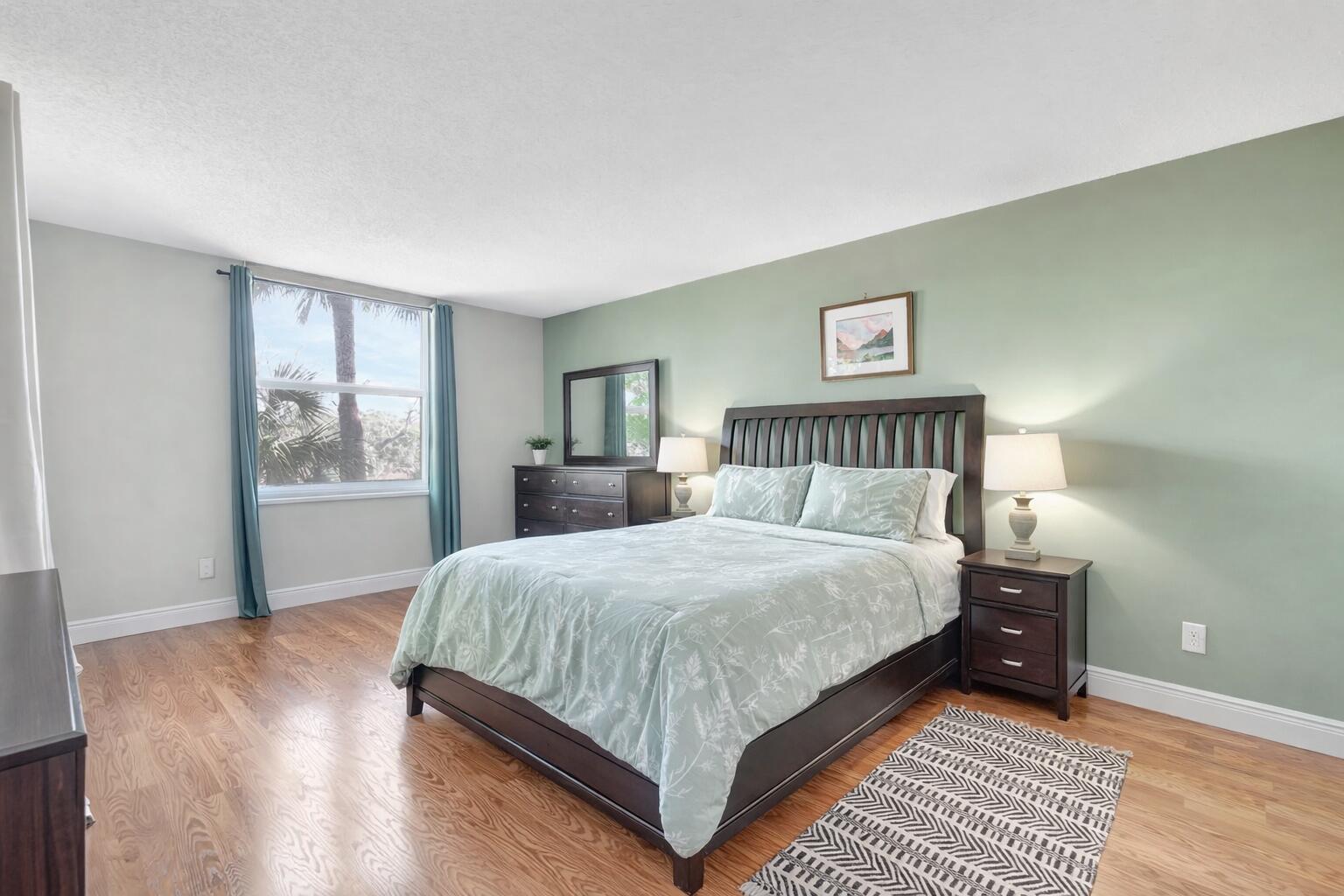 5260 Northwest 2nd Avenue, Unit 307 Boca Raton, FL 33487 - Photo 9 of 16 a bedroom with a large bed and a window