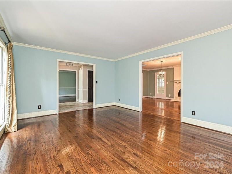 3711 High Ridge Road Charlotte, NC 28270 - Photo 11 of 39 a view of empty room with wooden floor and fan