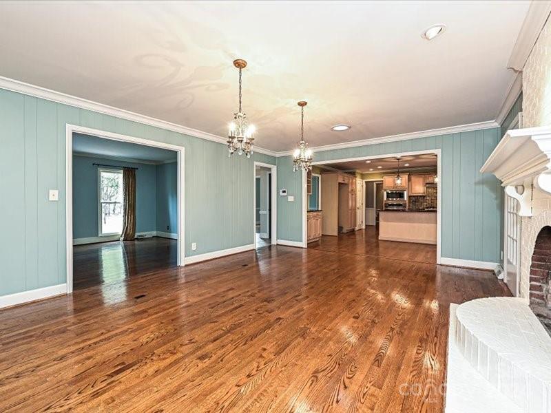 3711 High Ridge Road Charlotte, NC 28270 - Photo 12 of 39 a view of a livingroom with furniture wooden floor and a ceiling fan