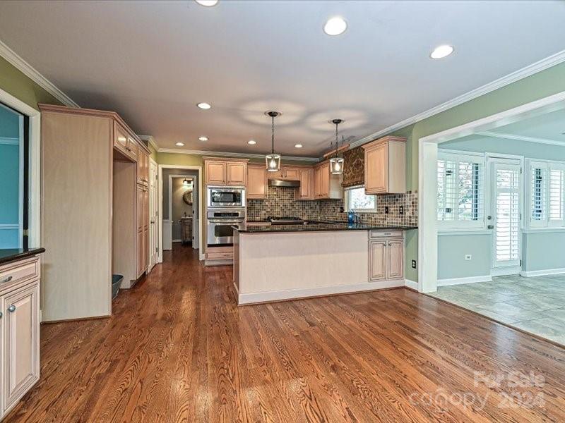 3711 High Ridge Road Charlotte, NC 28270 - Photo 15 of 39 a large kitchen with stainless steel appliances refrigerator stove microwave and cabinets