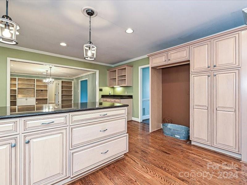 3711 High Ridge Road Charlotte, NC 28270 - Photo 17 of 39 a view of a hallway with granite countertop cabinets and window