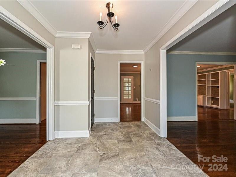 3711 High Ridge Road Charlotte, NC 28270 - Photo 7 of 39 a view of a hallway view with wooden floor and staircase