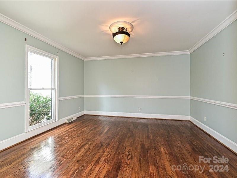 3711 High Ridge Road Charlotte, NC 28270 - Photo 8 of 39 a view of an empty room with wooden floor and a window