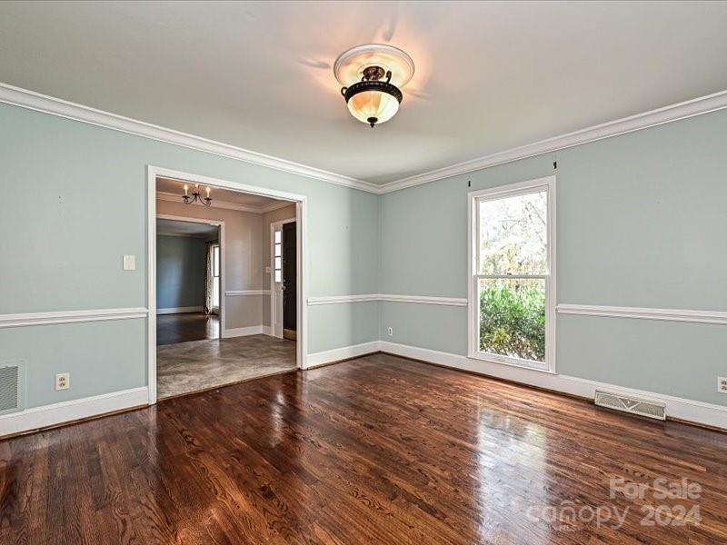 3711 High Ridge Road Charlotte, NC 28270 - Photo 9 of 39 a view of an empty room with wooden floor and a window