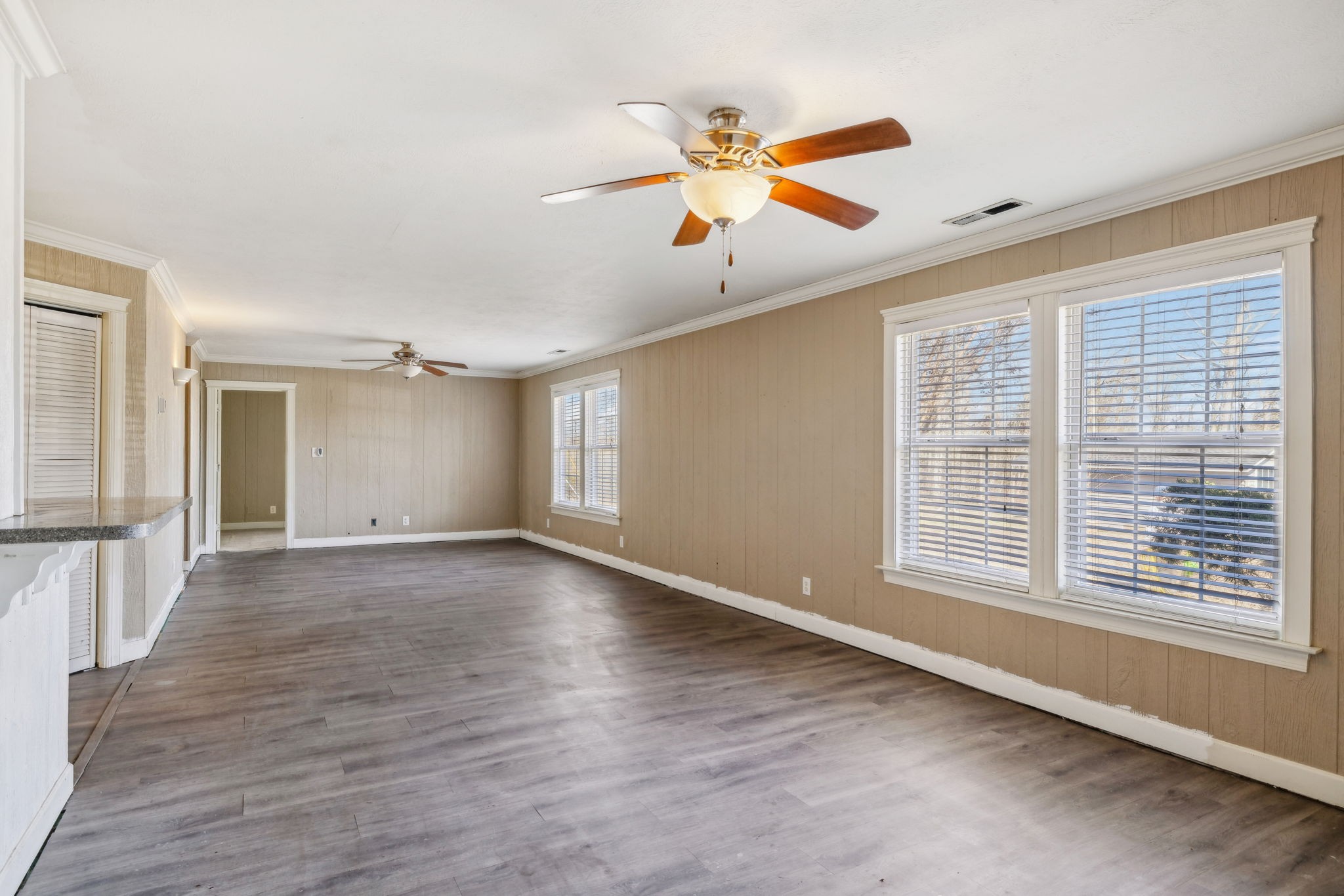 2185 Joe Brown Road Spring Hill, TN 37174 - Photo 11 of 96 a view of an empty room with wooden floor and a window