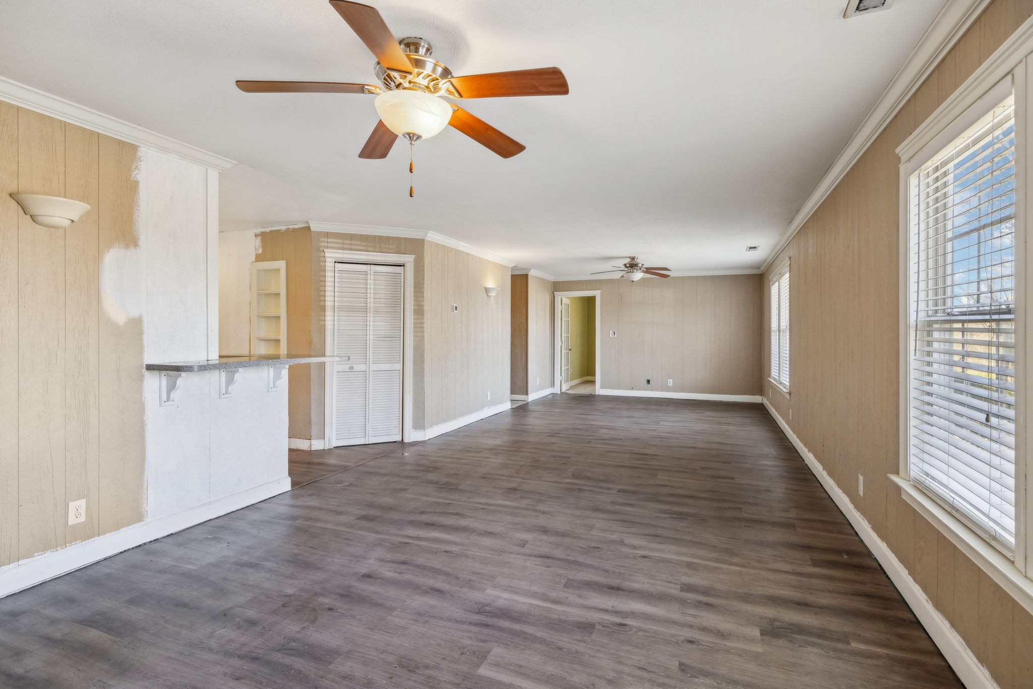 2185 Joe Brown Road Spring Hill, TN 37174 - Photo 12 of 96 a view of a livingroom with wooden floor a ceiling fan and windows