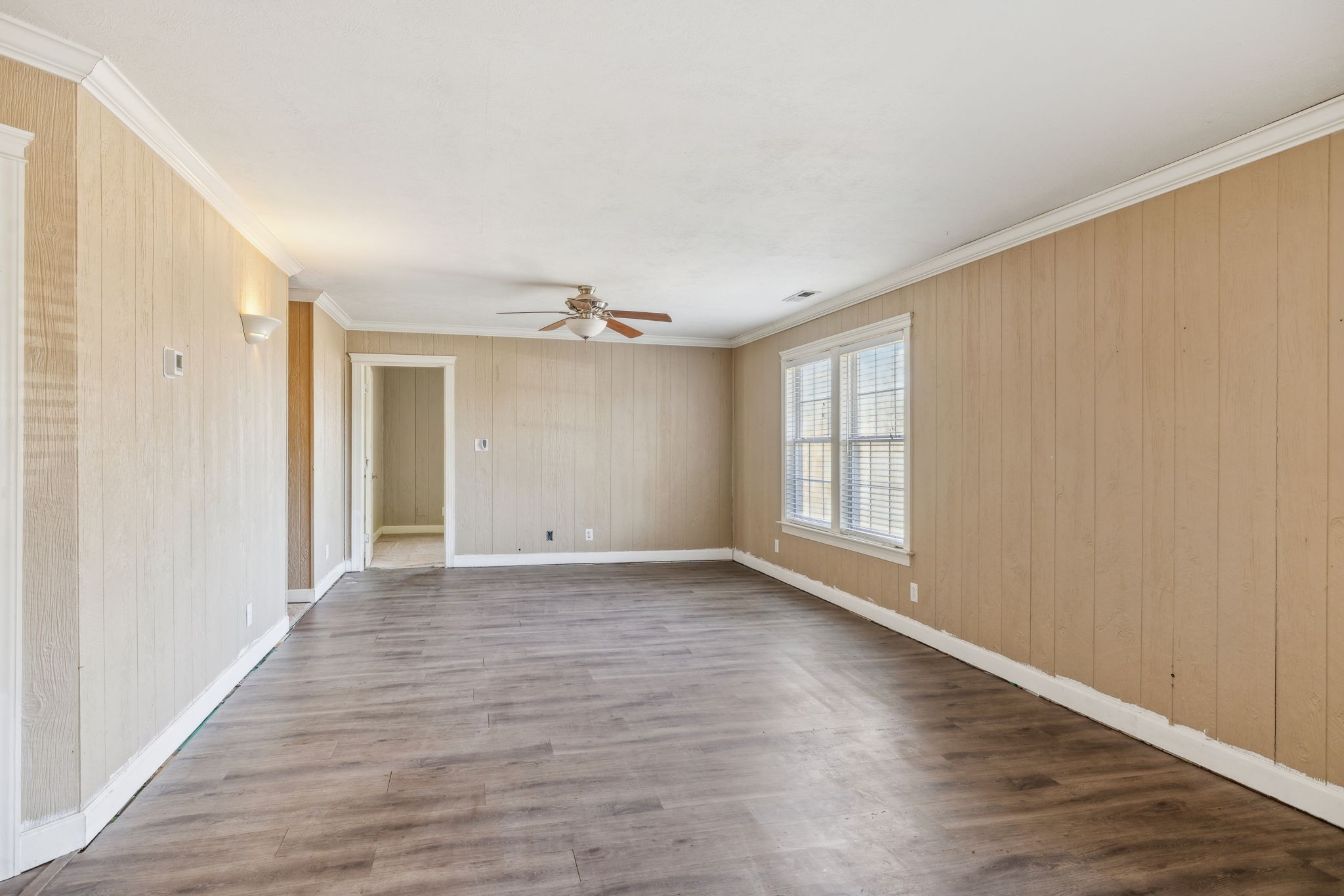 2185 Joe Brown Road Spring Hill, TN 37174 - Photo 13 of 96 a view of an empty room with wooden floor and a window