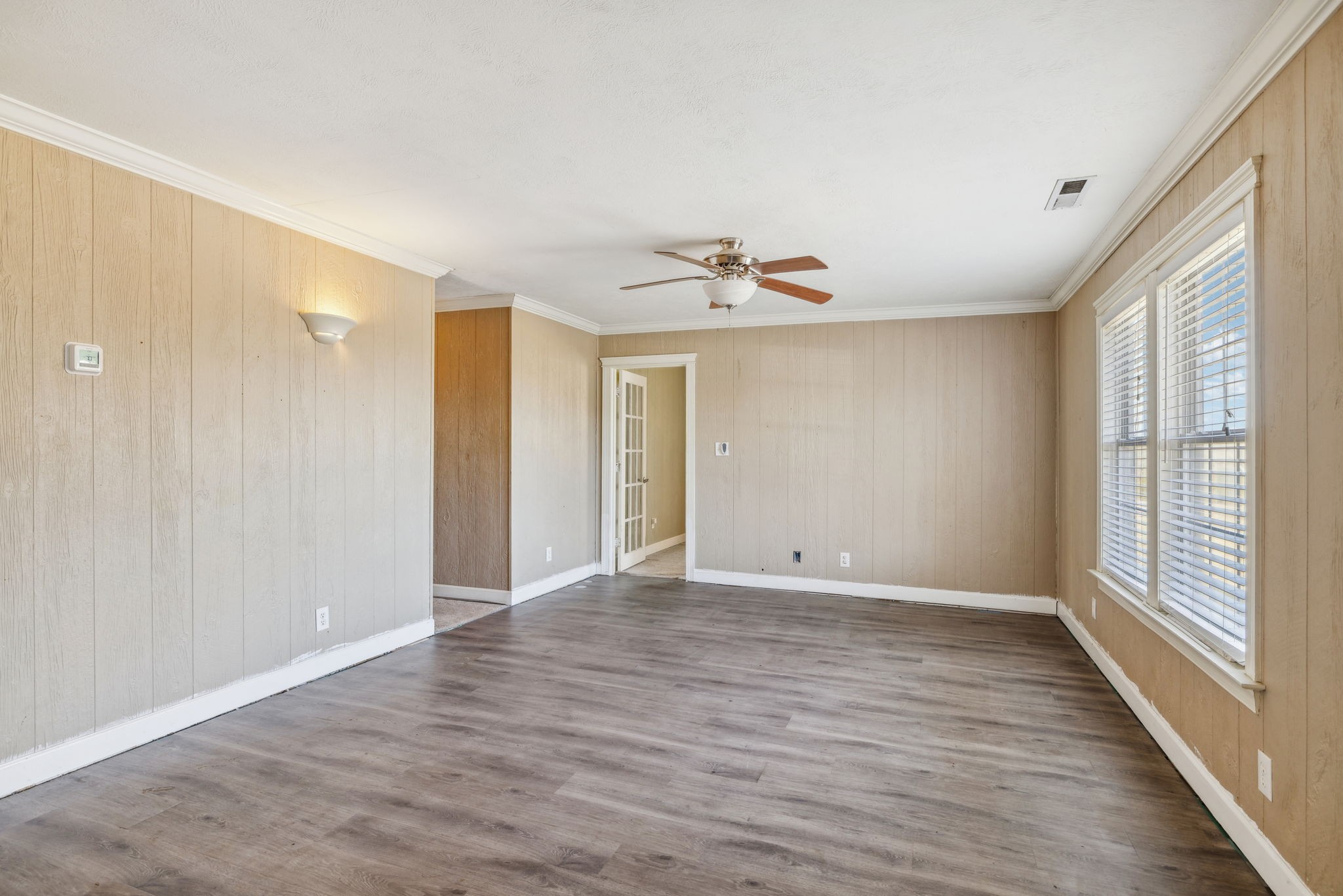 2185 Joe Brown Road Spring Hill, TN 37174 - Photo 14 of 96 a view of an empty room with wooden floor and a window