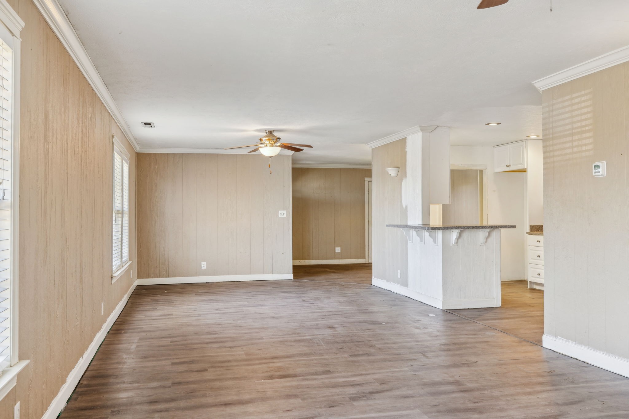 2185 Joe Brown Road Spring Hill, TN 37174 - Photo 17 of 96 a view of empty room with wooden floor and kitchen