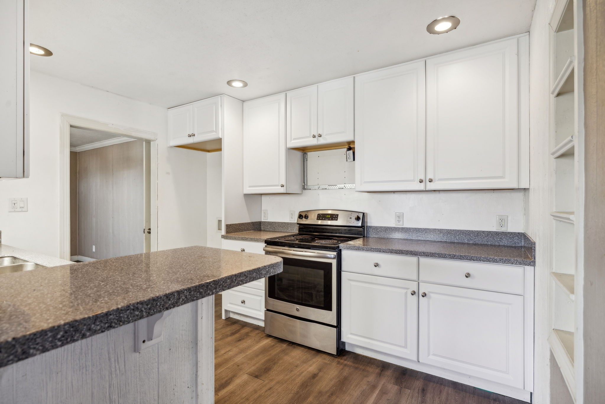 2185 Joe Brown Road Spring Hill, TN 37174 - Photo 19 of 96 a kitchen with granite countertop white cabinets and appliances