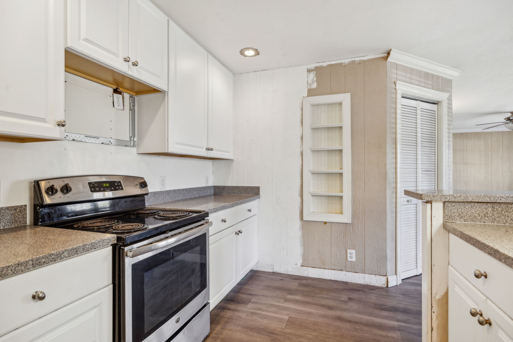 2185 Joe Brown Road Spring Hill, TN 37174 - Photo 22 of 96 a kitchen with granite countertop cabinets appliances and wooden floor
