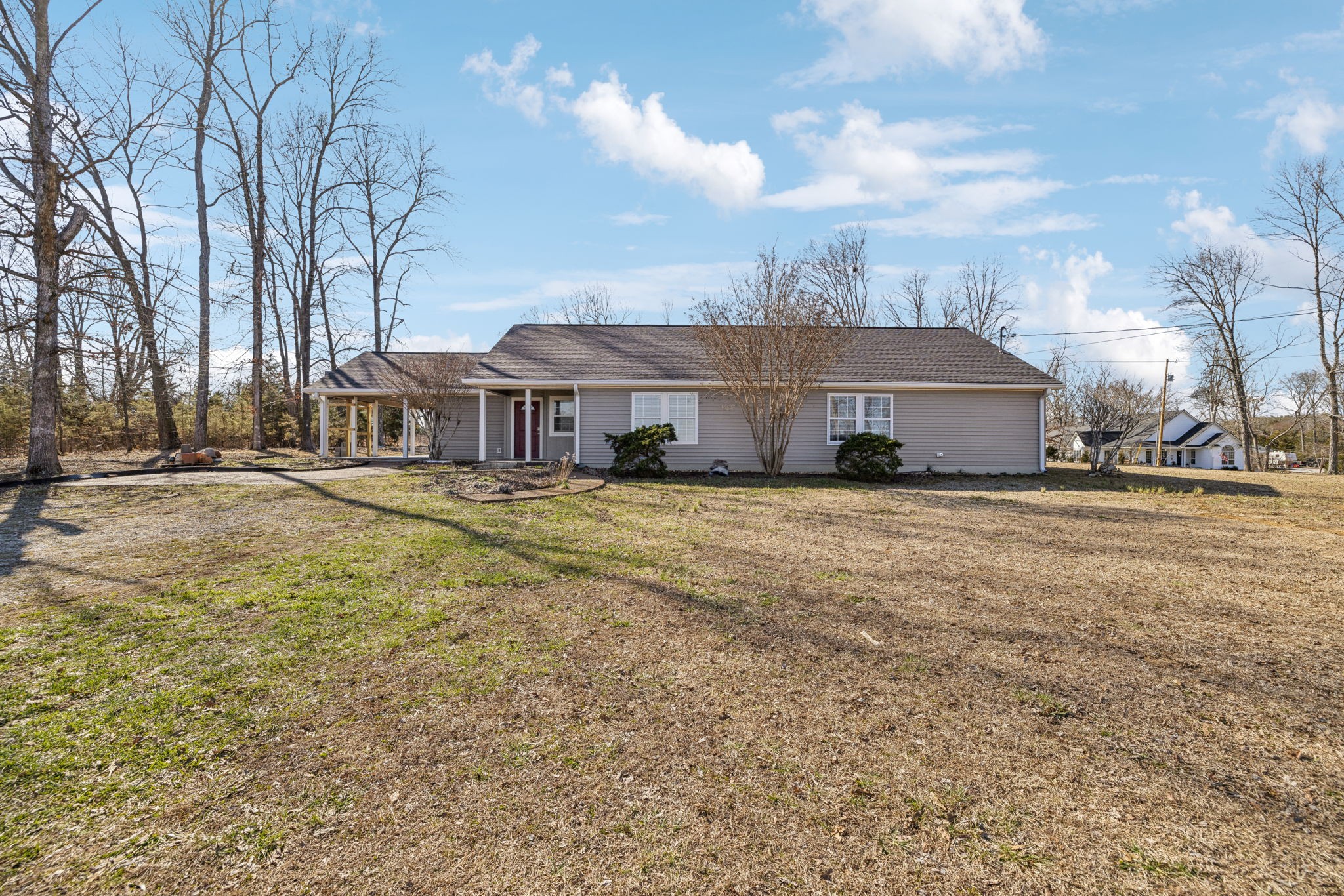 2185 Joe Brown Road Spring Hill, TN 37174 - Photo 5 of 96 a view of a house with a big yard and large trees