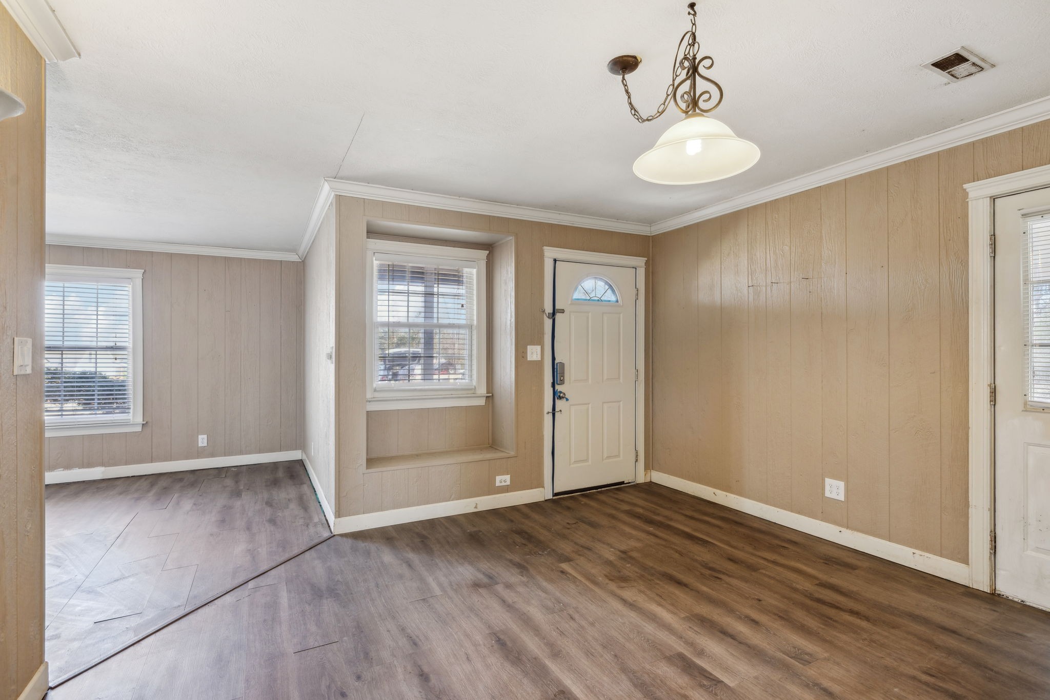 2185 Joe Brown Road Spring Hill, TN 37174 - Photo 9 of 96 an empty room with wooden floor and windows