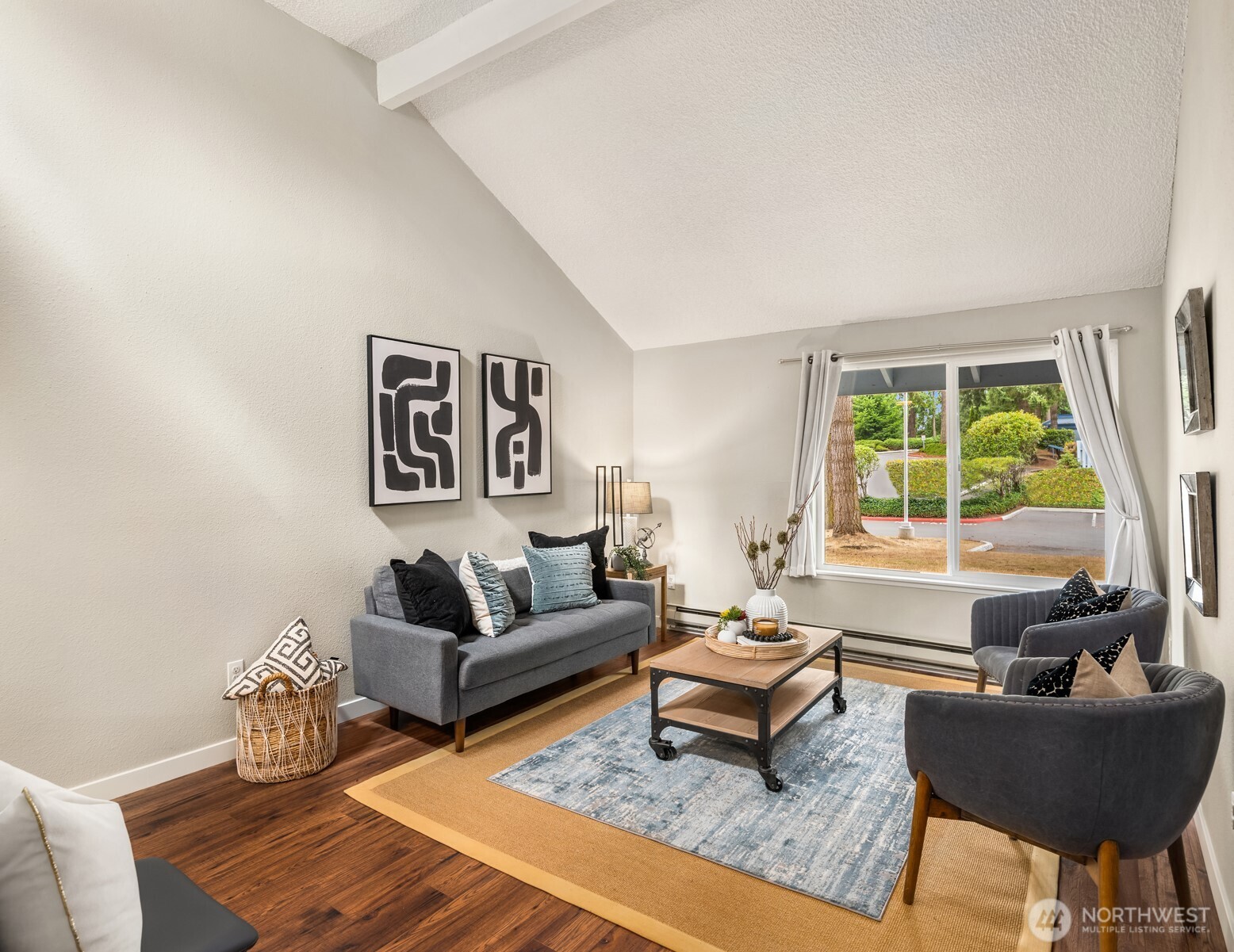a living room with furniture and a large window
